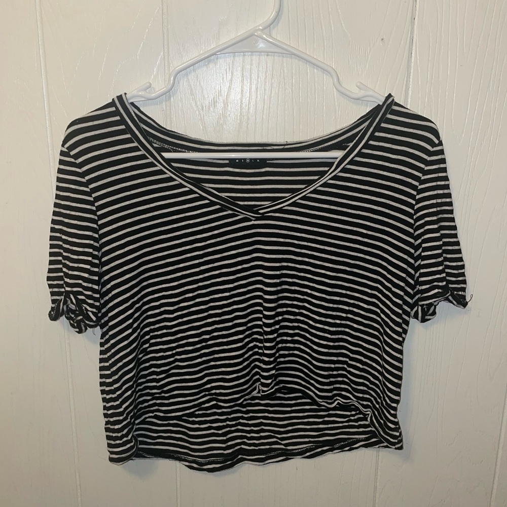 A crop te-shirt with black and white strips